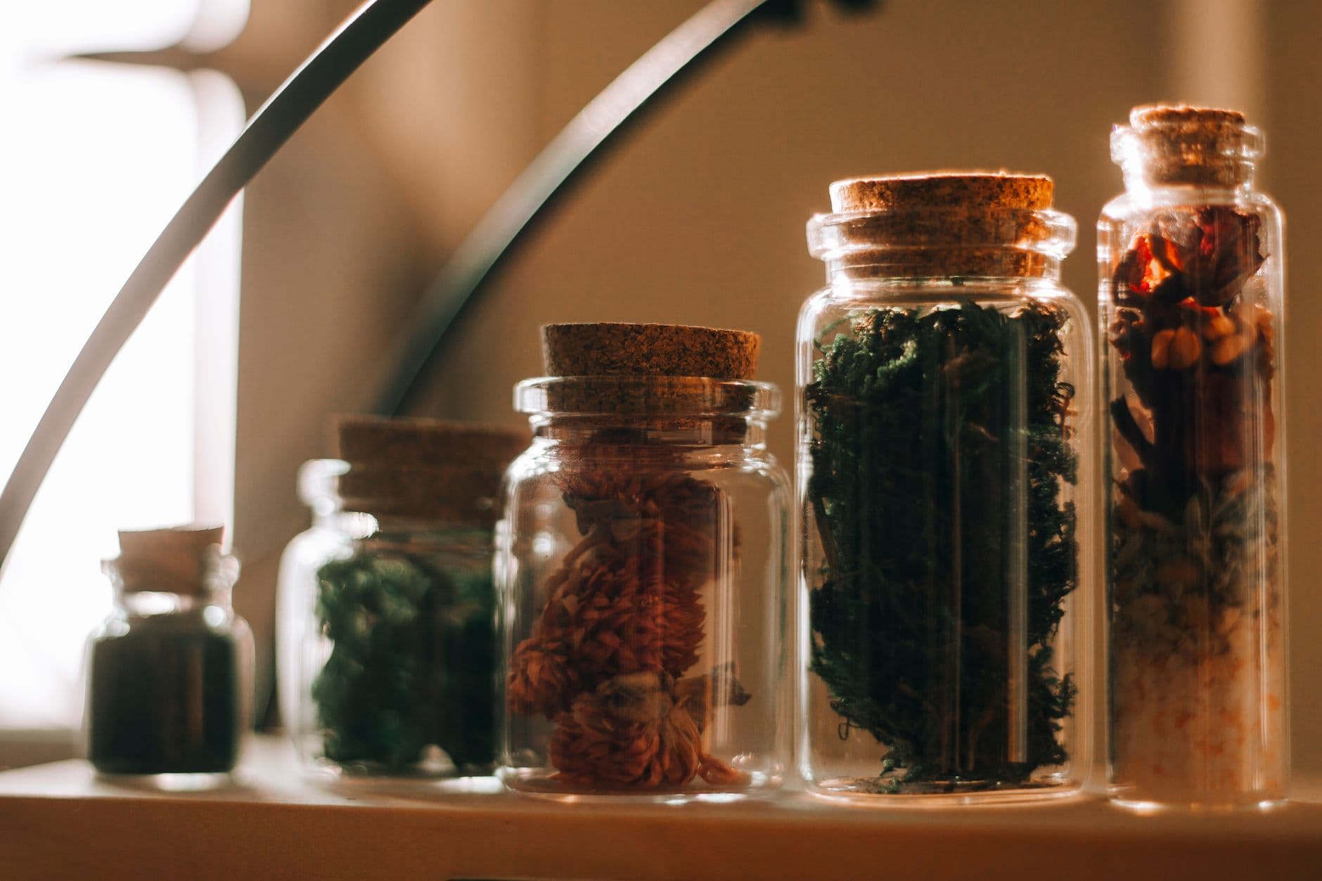 Shelves of amber glass apothecary jars